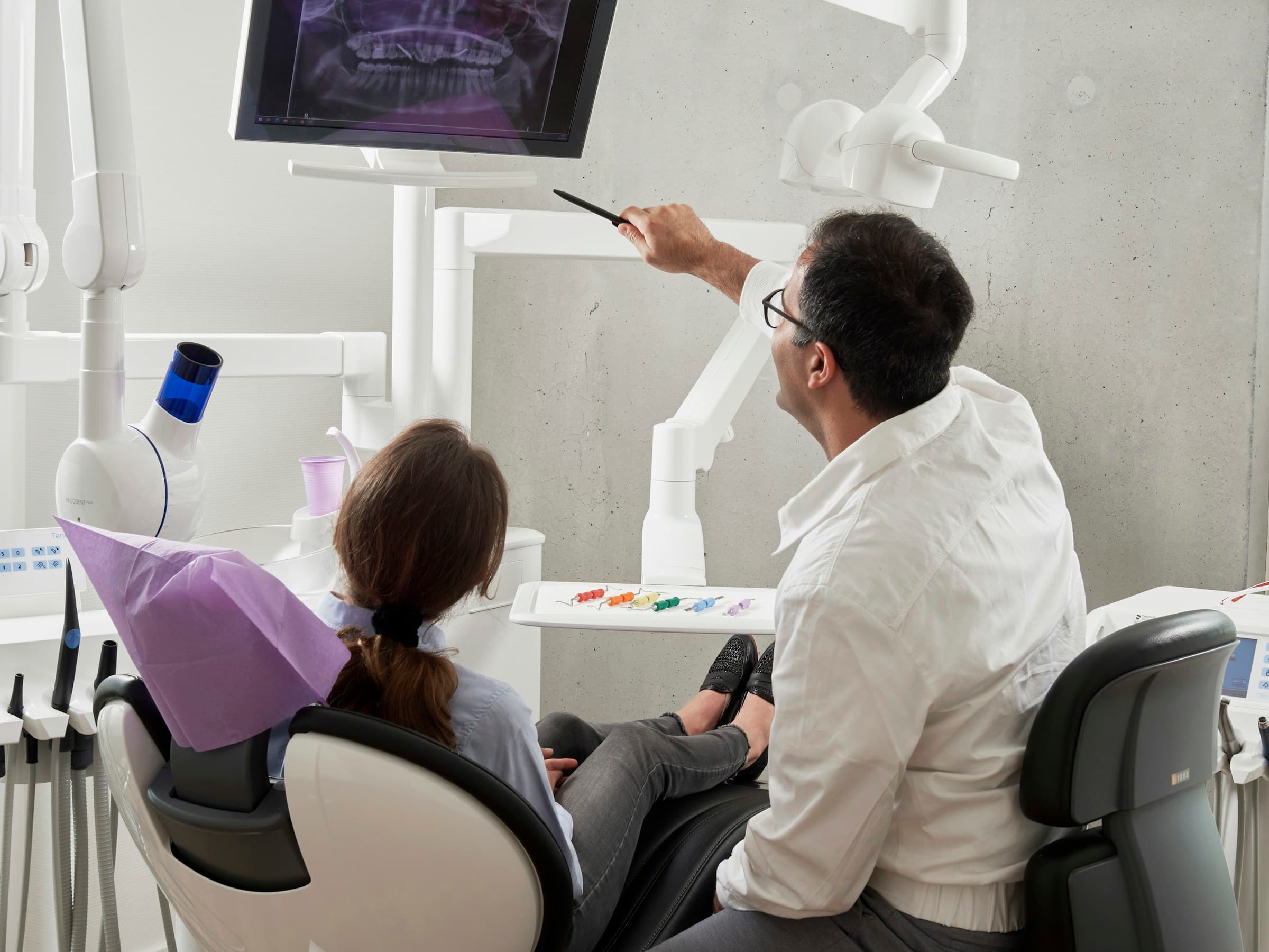 A dental clinician at work, focused and composed